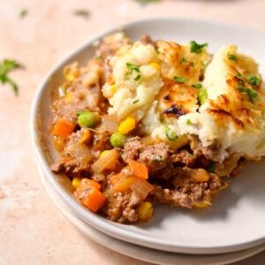 A plate with shepherds pie on it.