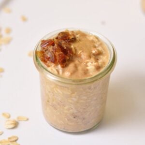 Up close image of overnight oats with dates on top.
