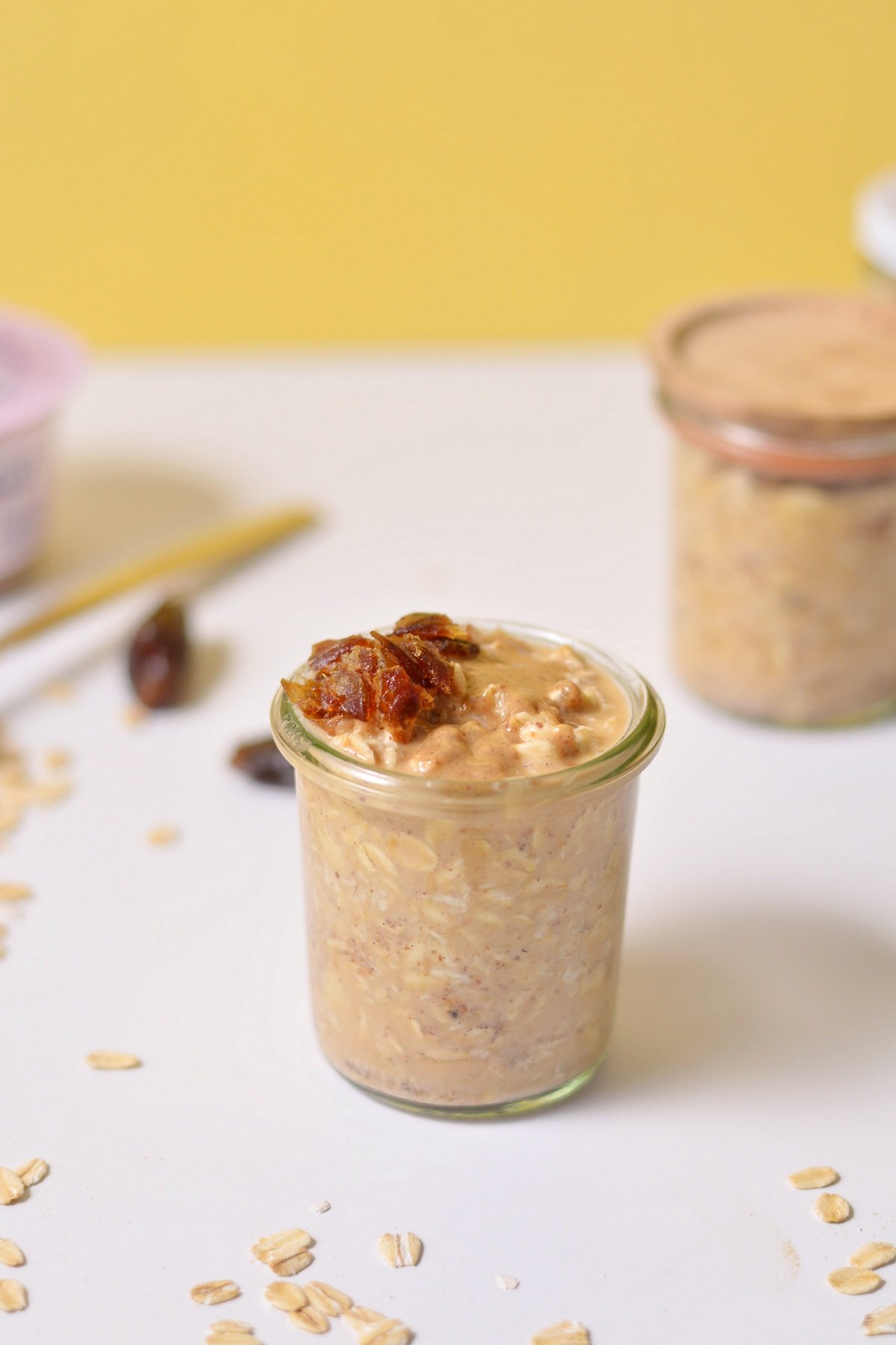 Up close image of overnight oats with dates on top.