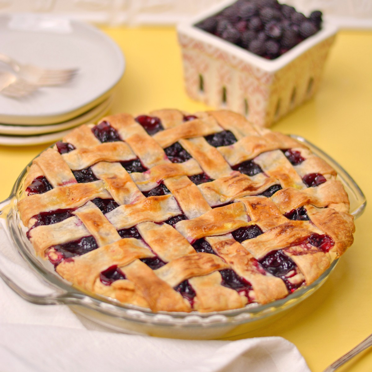 Black Raspeberry pie with latticed crust on top.
