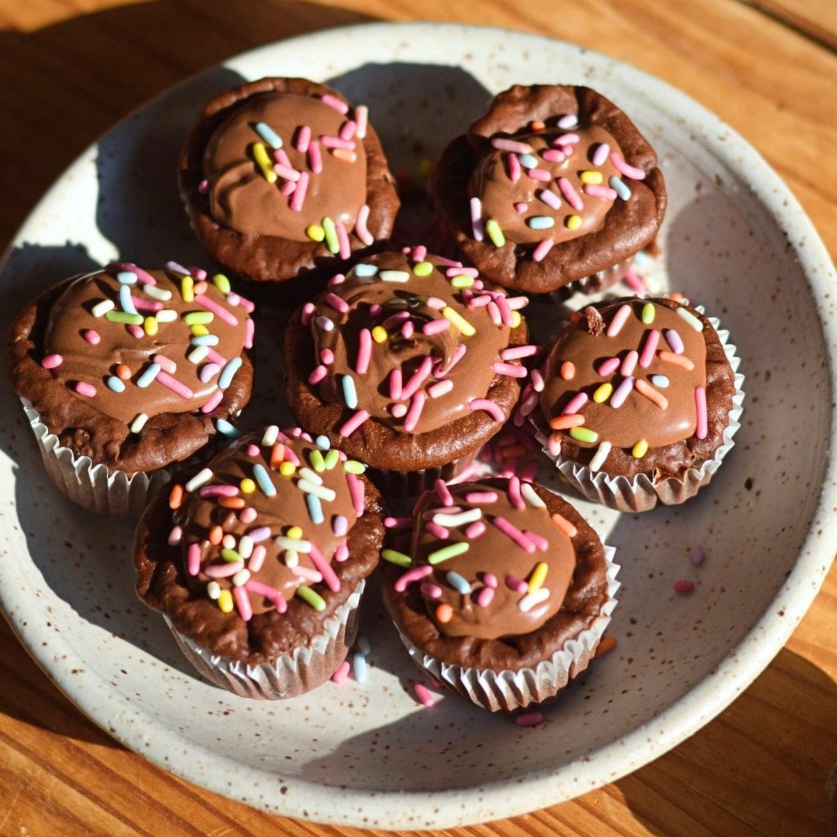 A plate of chocolate protein cupcakes.