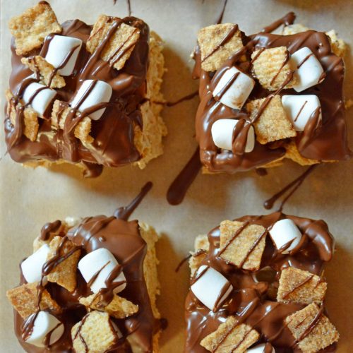 Cinnamon toast crunch cereal bars with coated in marshmallows and chocolate.