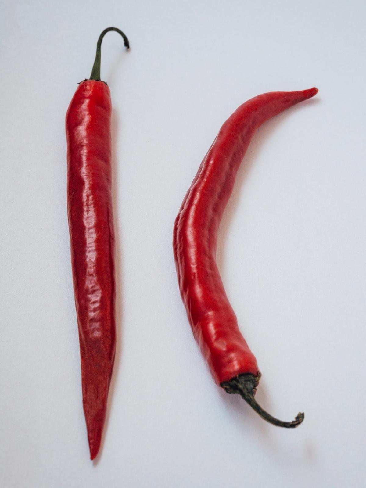 two red cayenne peppers
