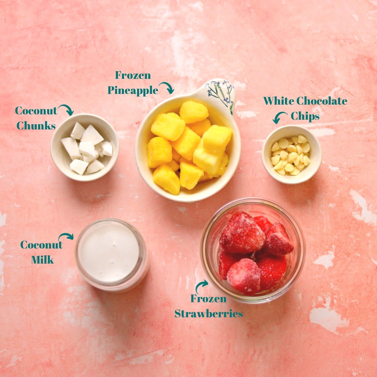 An overhead view of smoothie ingredients in separate bowls.