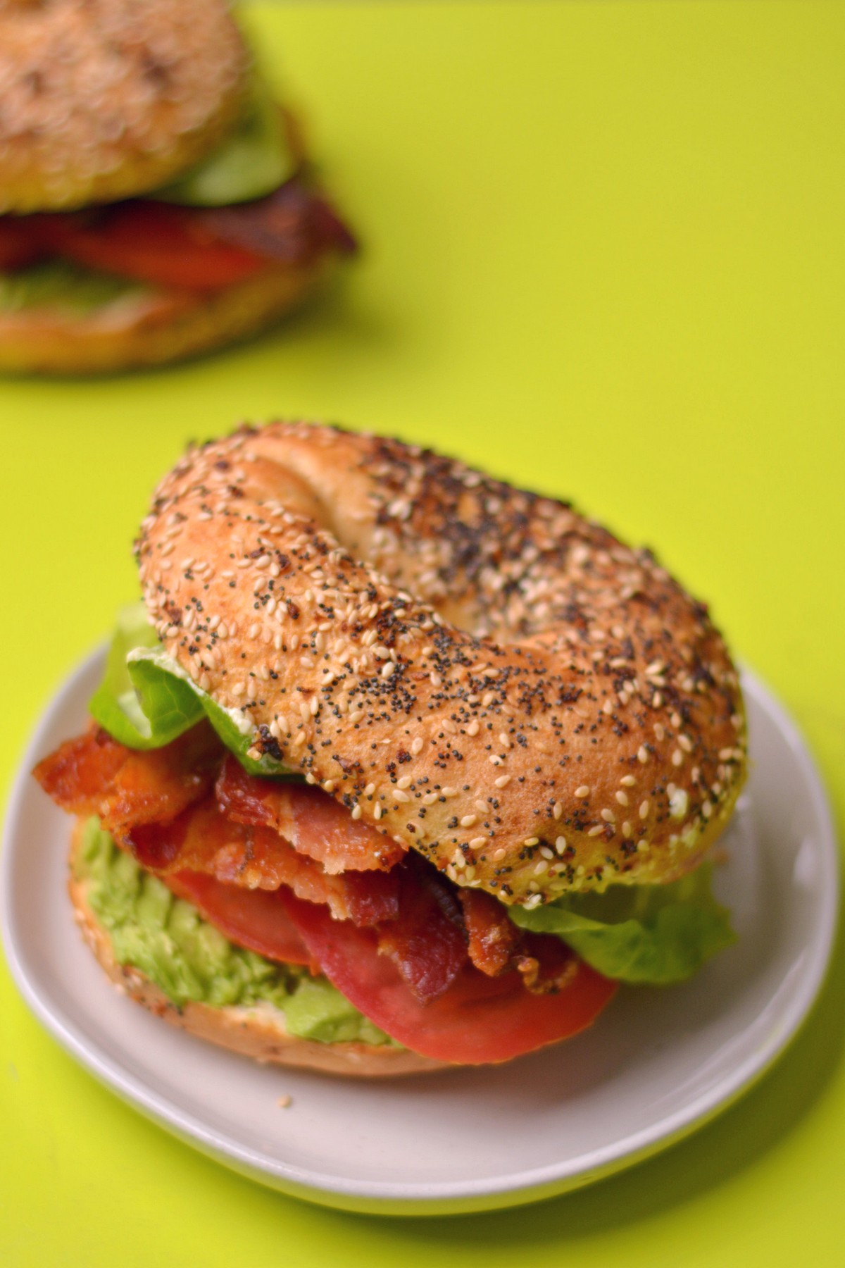 A bagel blt on a plate.