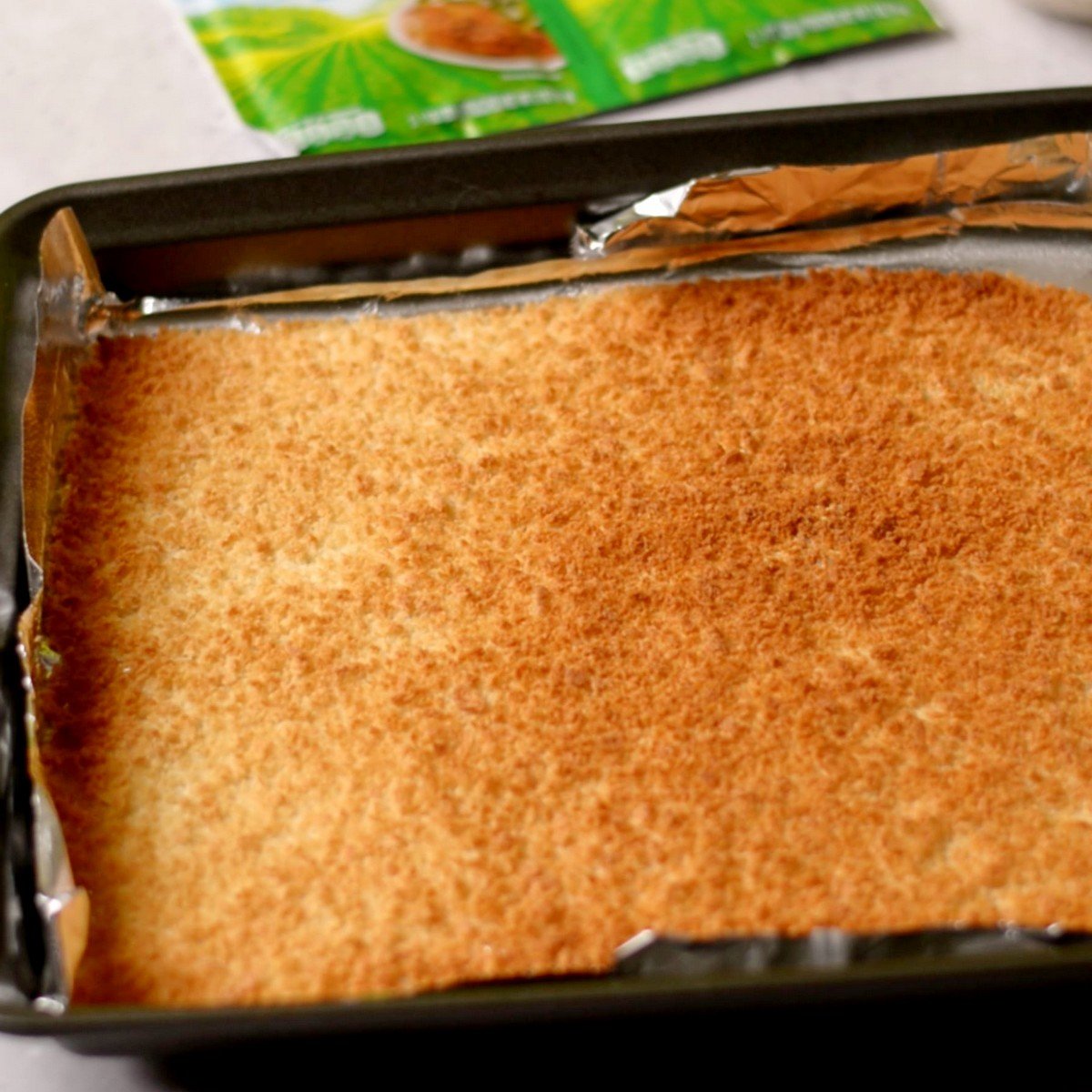Toasted panko breadcrumbs on a baking tray.