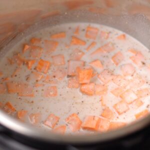Sweet potato pieces with milk in an Instant pot.