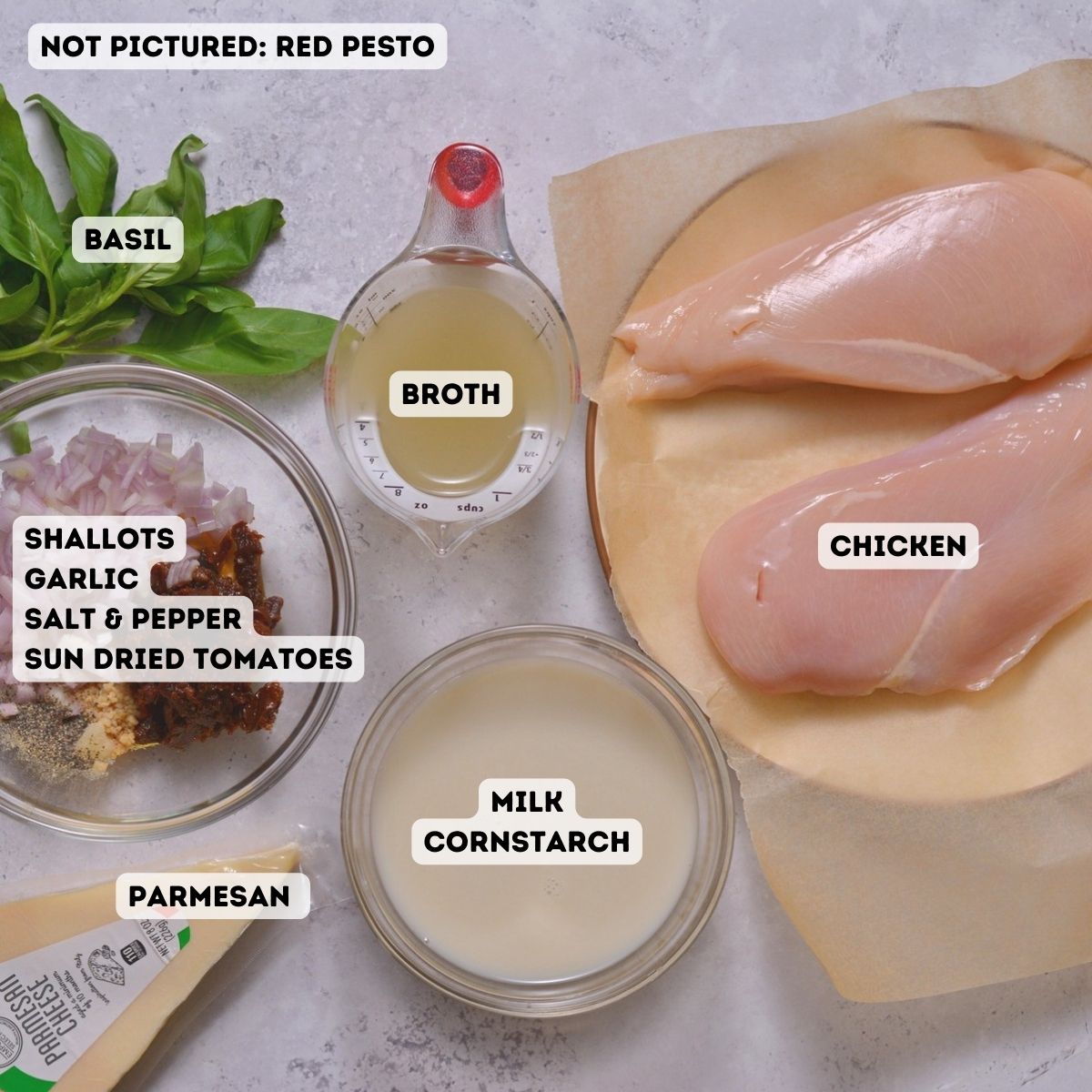 Ingredients including red pesto, chicken, basil, broth, milk, cornstarch, sun dried tomatoes, spices, garlic, and parmesan.