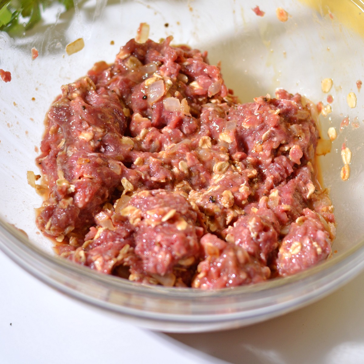 Step three of the meatloaf mixture in a bowl.