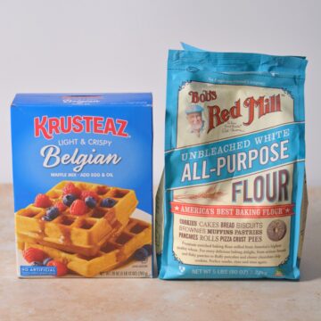 Krusteaz pancake mix box next to bob's red mill all purpose flour.