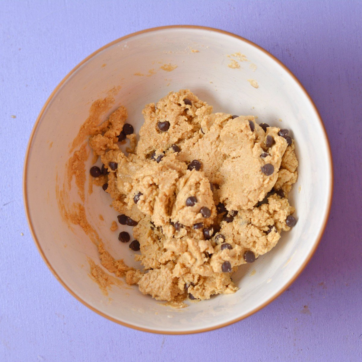 Protein cookie dough mixed in a bowl.