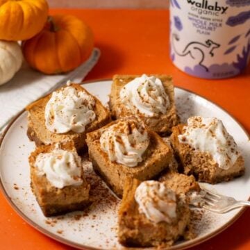 Pumpkin cheesecake bites on a plate.