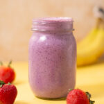 A berry protein shake without protein powder in a mason jar.