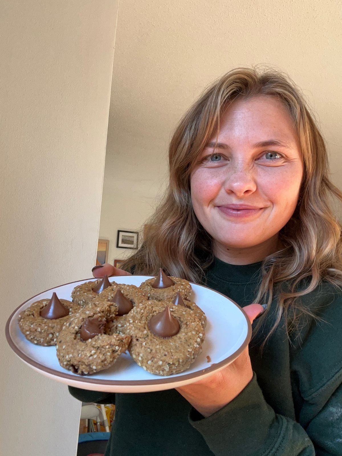 Mika holding the tray of cookies.