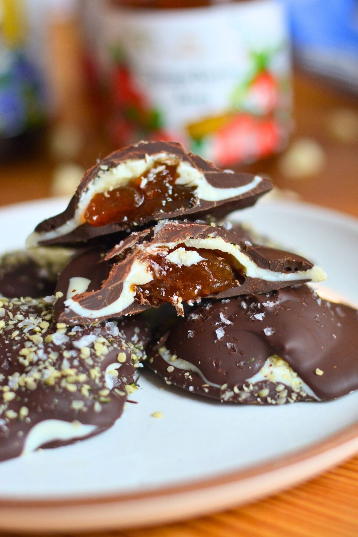 Two chocolate clusters cut open to show the jam inside.