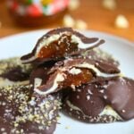 Two chocolate clusters cut open to show the jam inside.