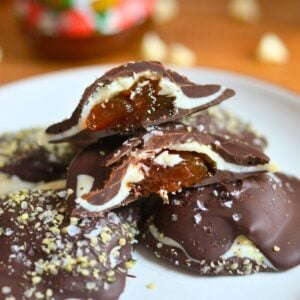Two chocolate clusters cut open to show the jam inside.