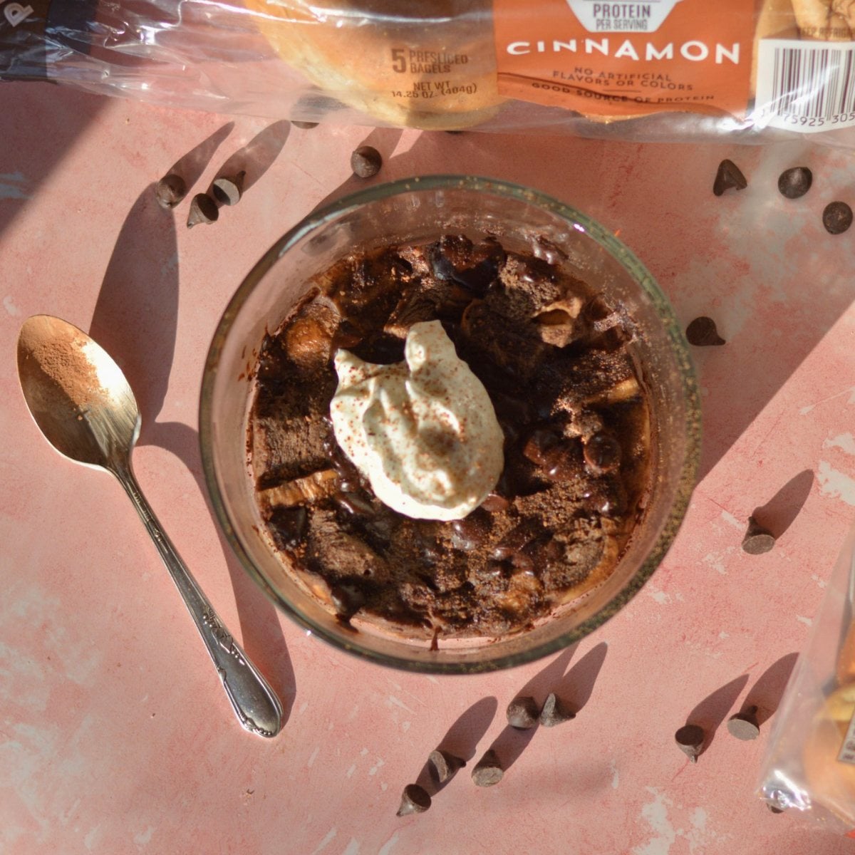 A bowl of high protein chocolate bread pudding with yogurt on top.