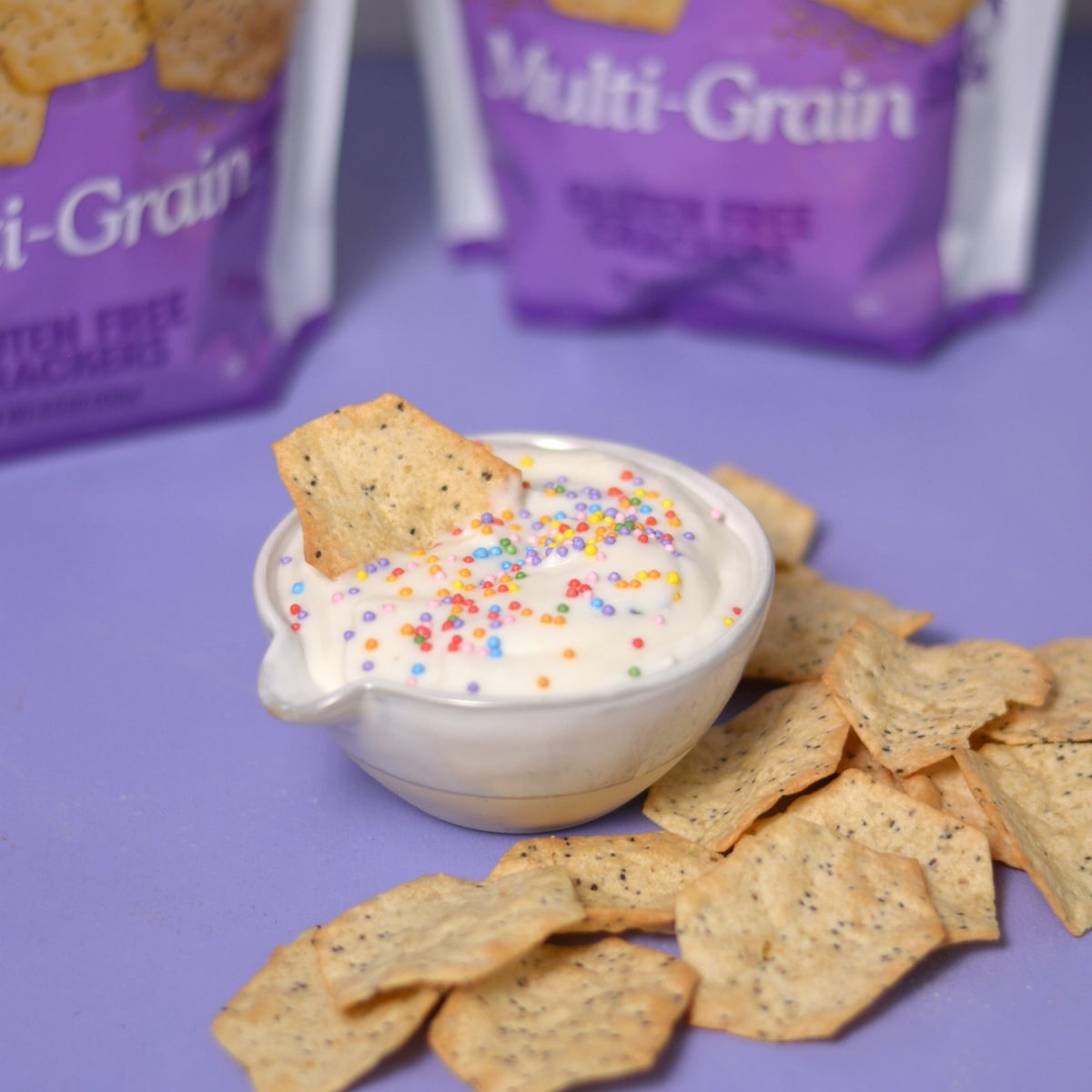 A bowl of high protein dunkaroo with a chip.