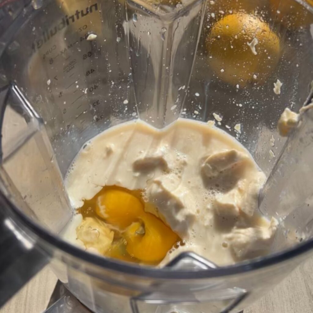 A blender with the ingredients before blending.