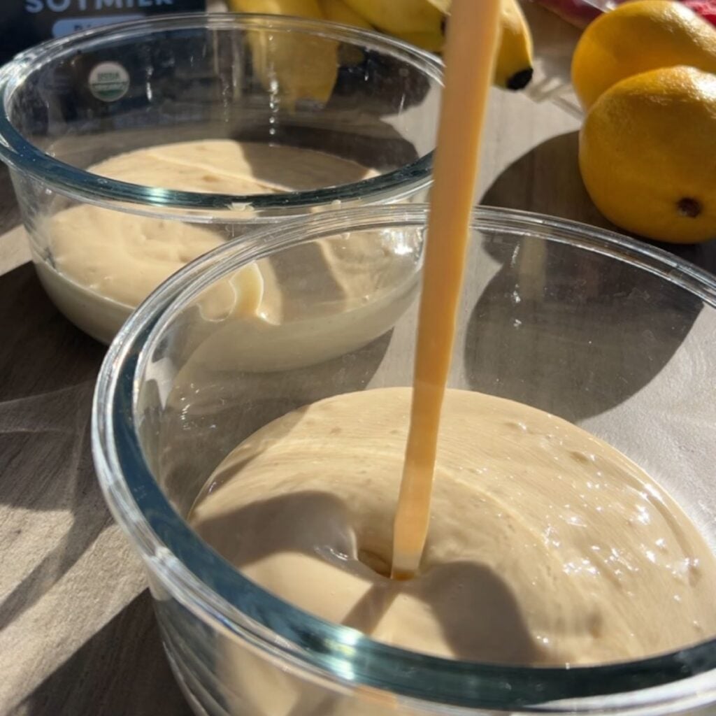 Pouring the protein batter into the microwave containers.