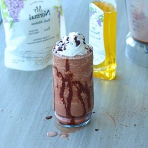 Dairy-free protein frappuccino with chocolate drizzle in glass