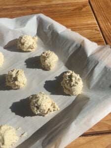 Lemon protein cookie dough on a sheet tray before baking.