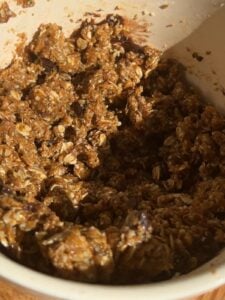 Cookie dough in a bowl to show the play doh like texture with melted chocolate chips