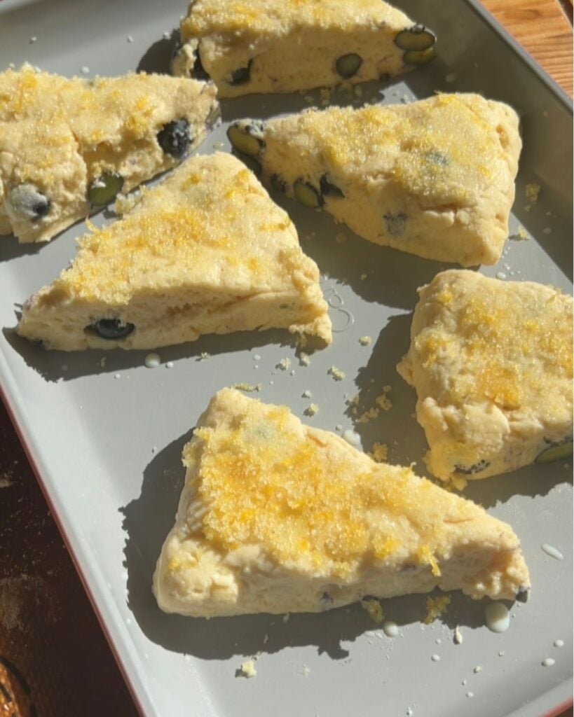 Scones before baking with the lemon sugar and milk topping.