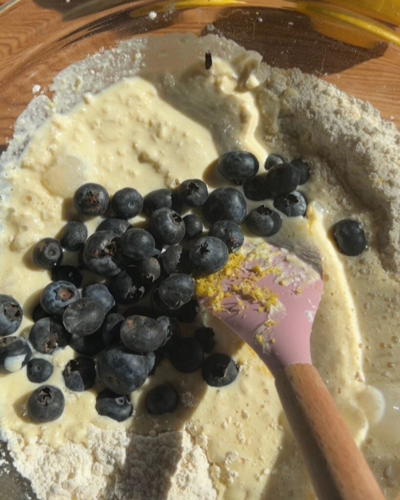 Blueberries with the wet and dry ingredients.