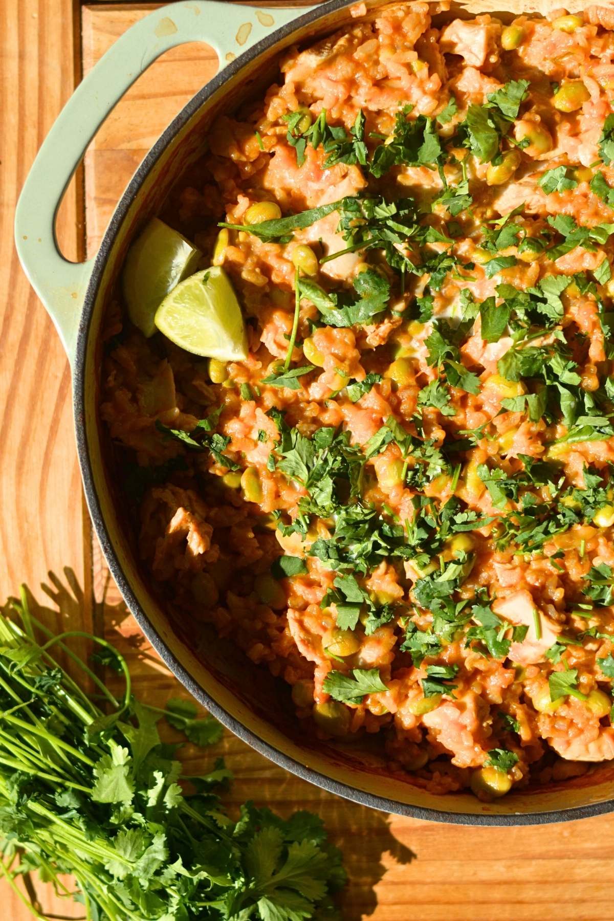 A braiser pan with curry chicken and rice.