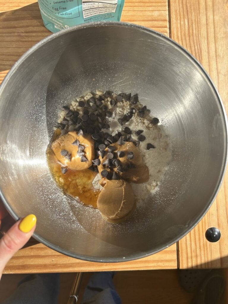 A bowl with the peanut butter protein ball ingredients.