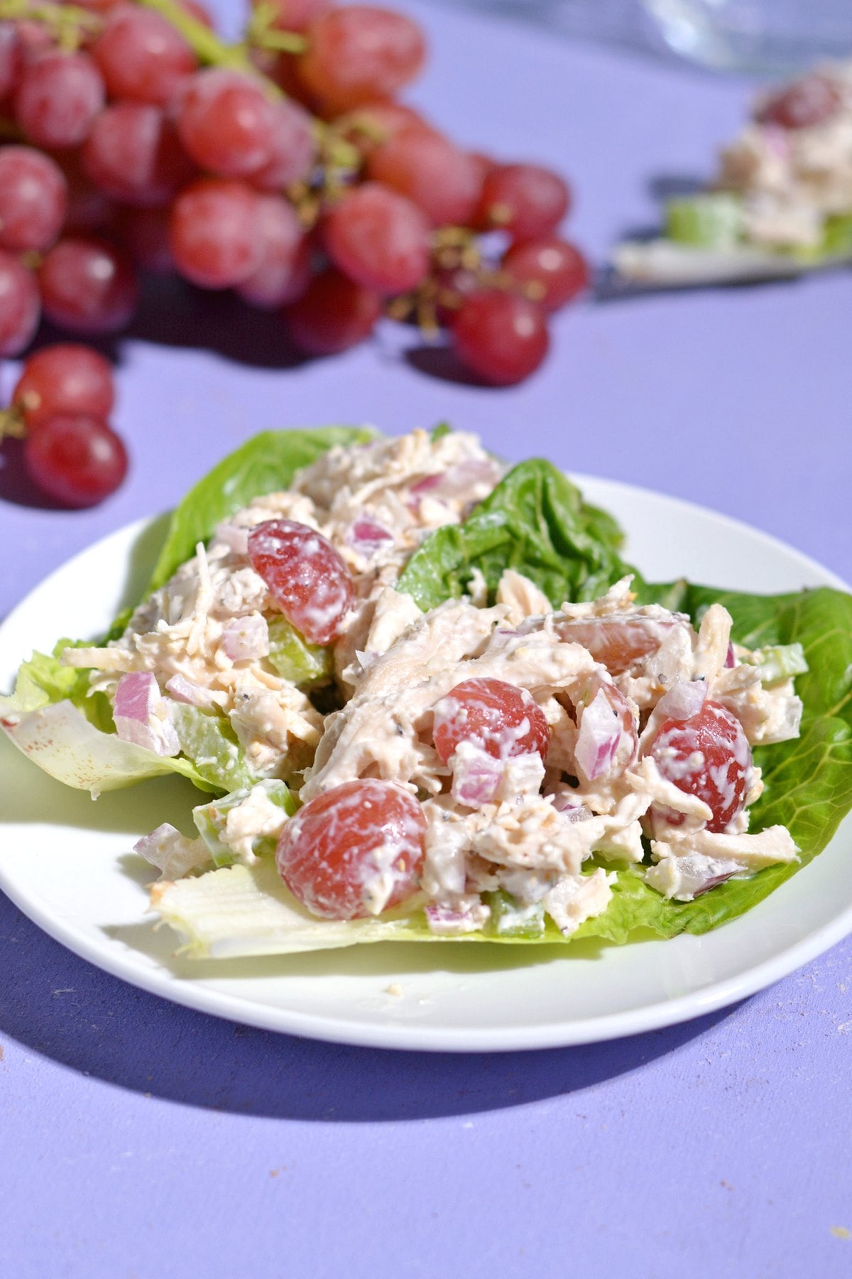 a plate with lettuce cups filled with california chicken salad.