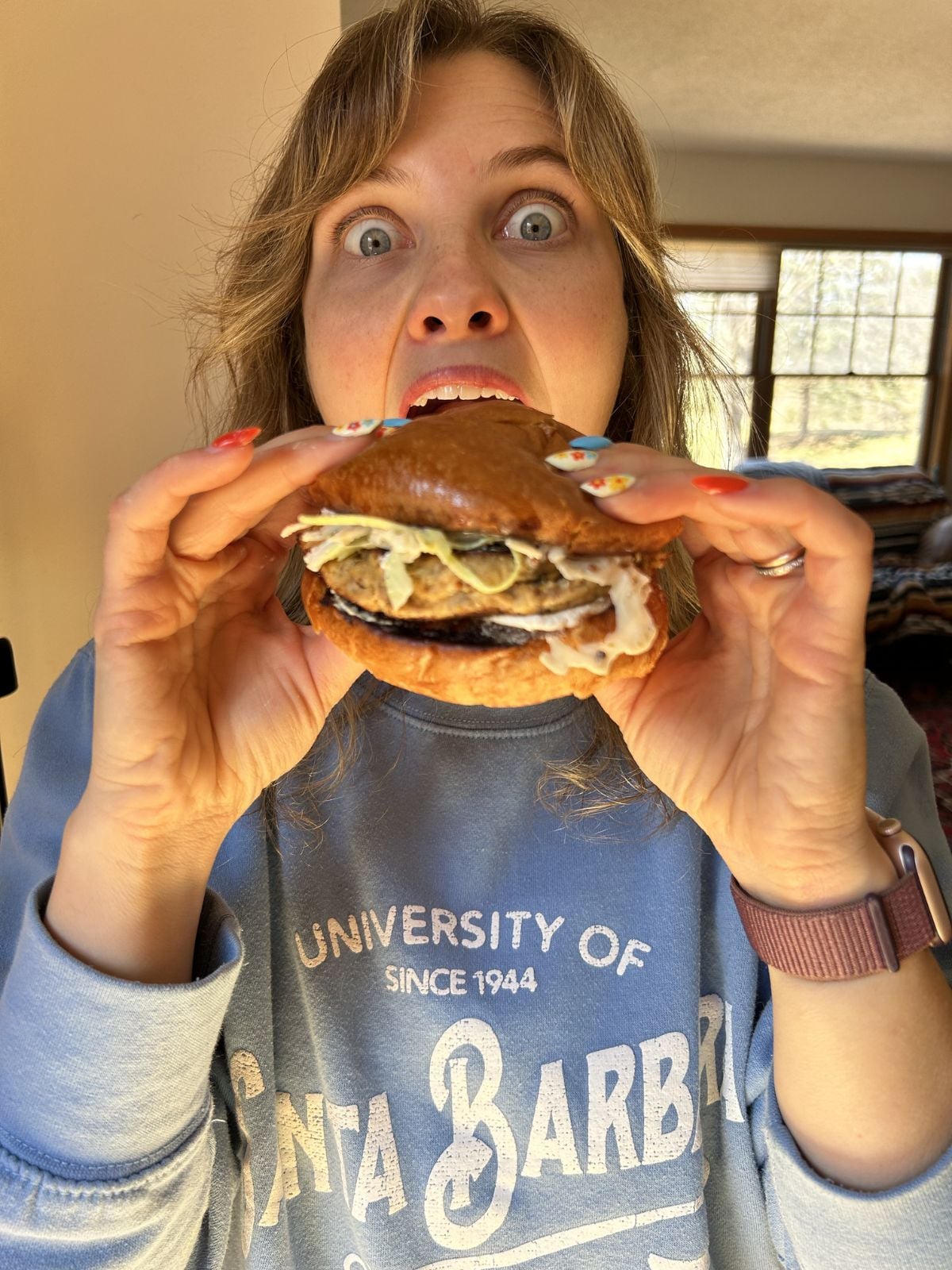 Mika about to eat the canned salmon burger.