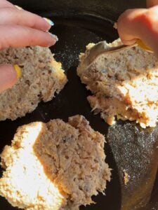 Shaping the canned salmon burgers.
