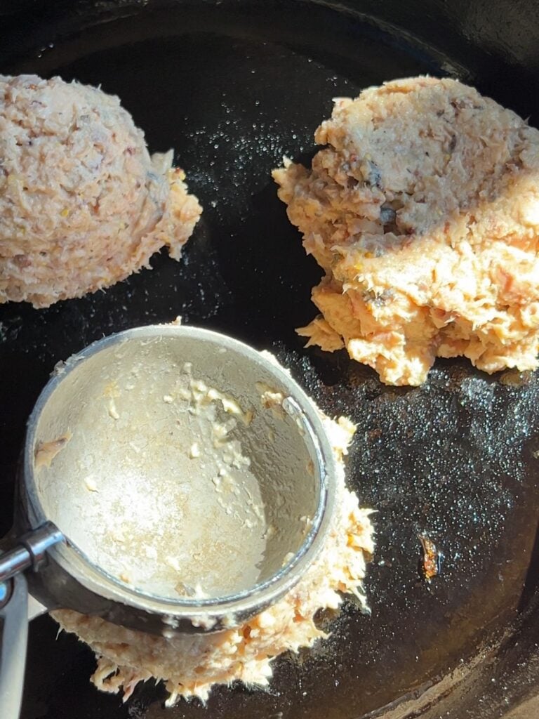 Shaping the canned salmon burgers.