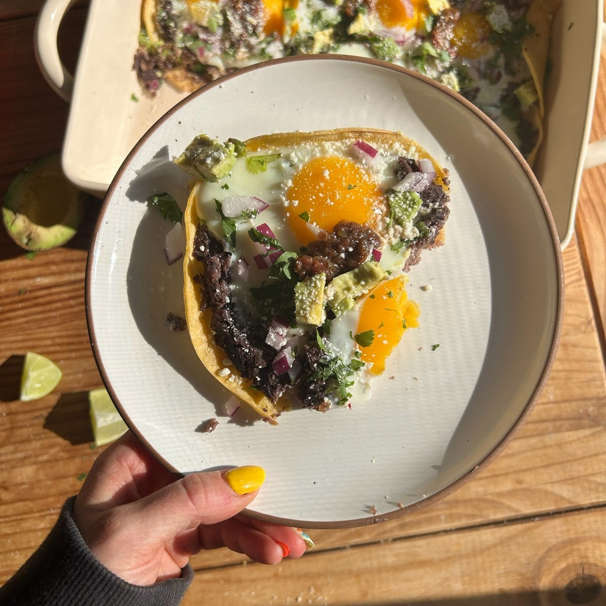 High protein low calorie huevos rancheros on a white plate.