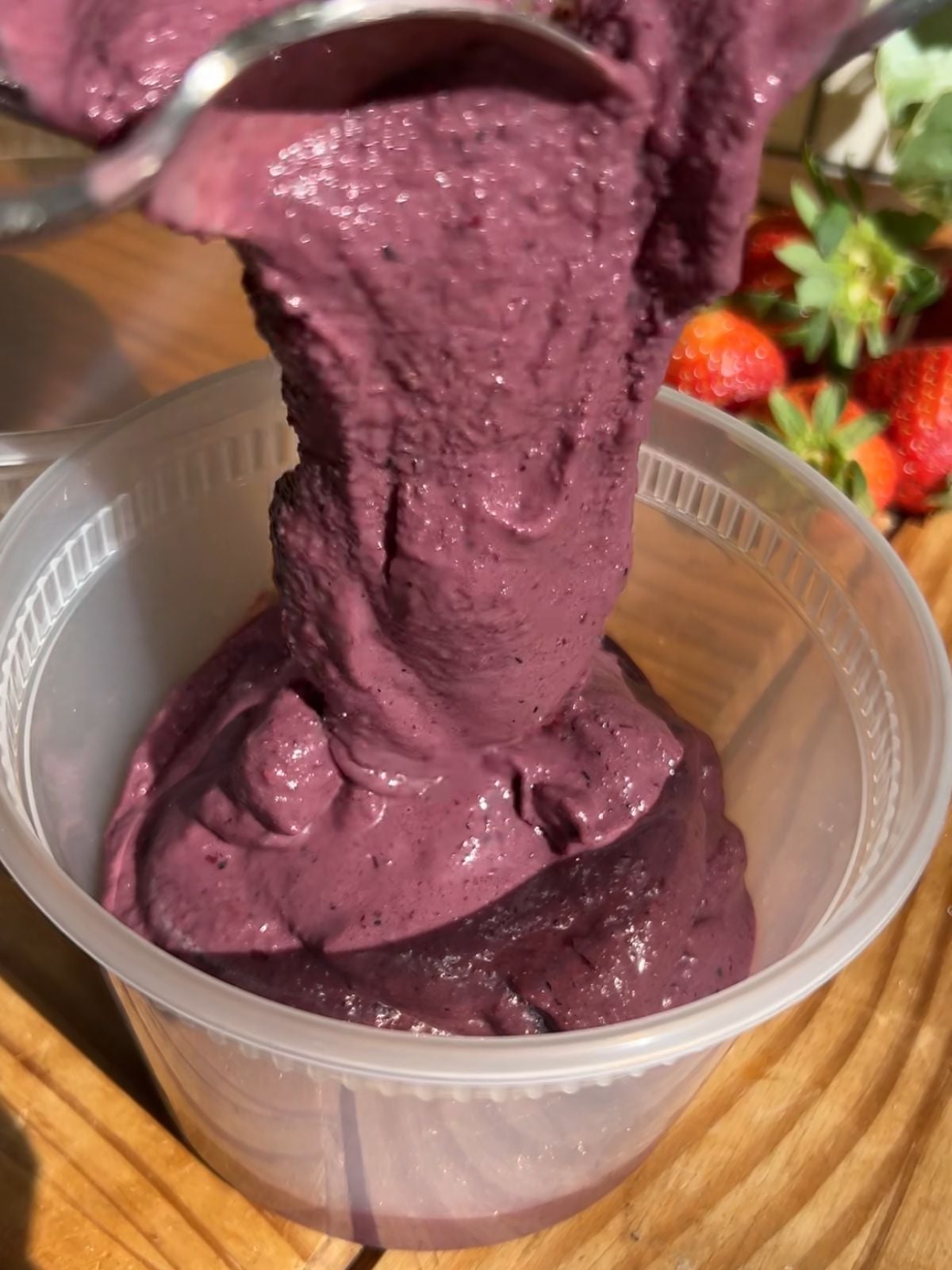 Protein acai being poured into a container.