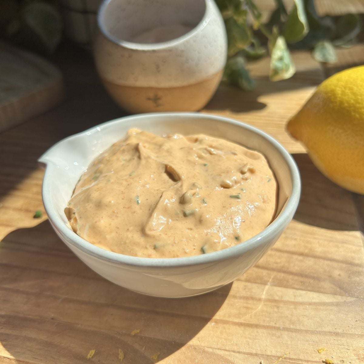 A bowl of greek yogurt sriracha sauce.
