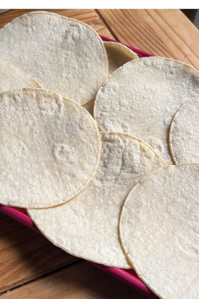 Overlapped tortillas in a tray.