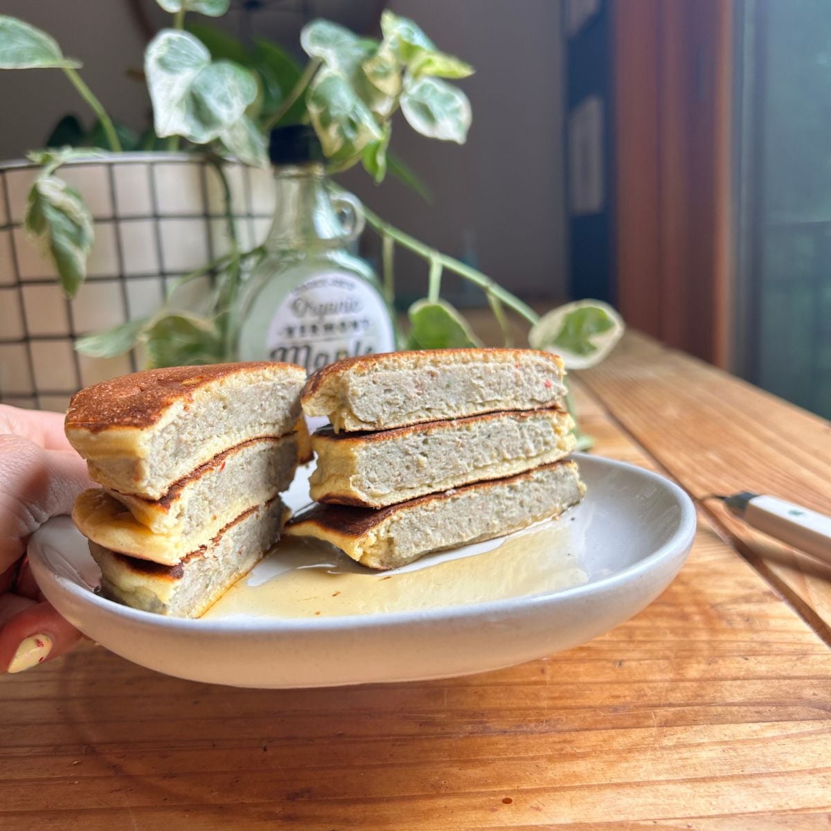 A plate of cut open pancake sausage patties.