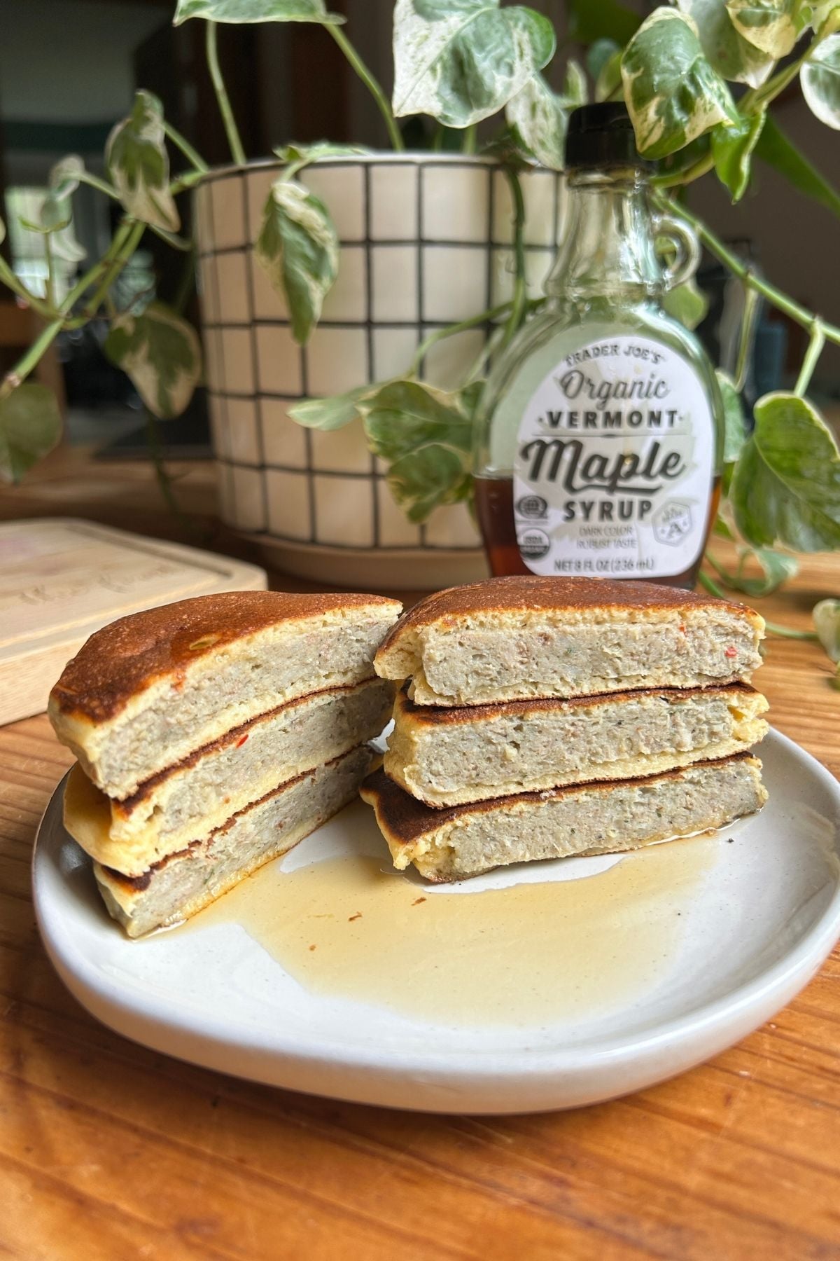 A stack of pancake protein sausage patties on a plate.