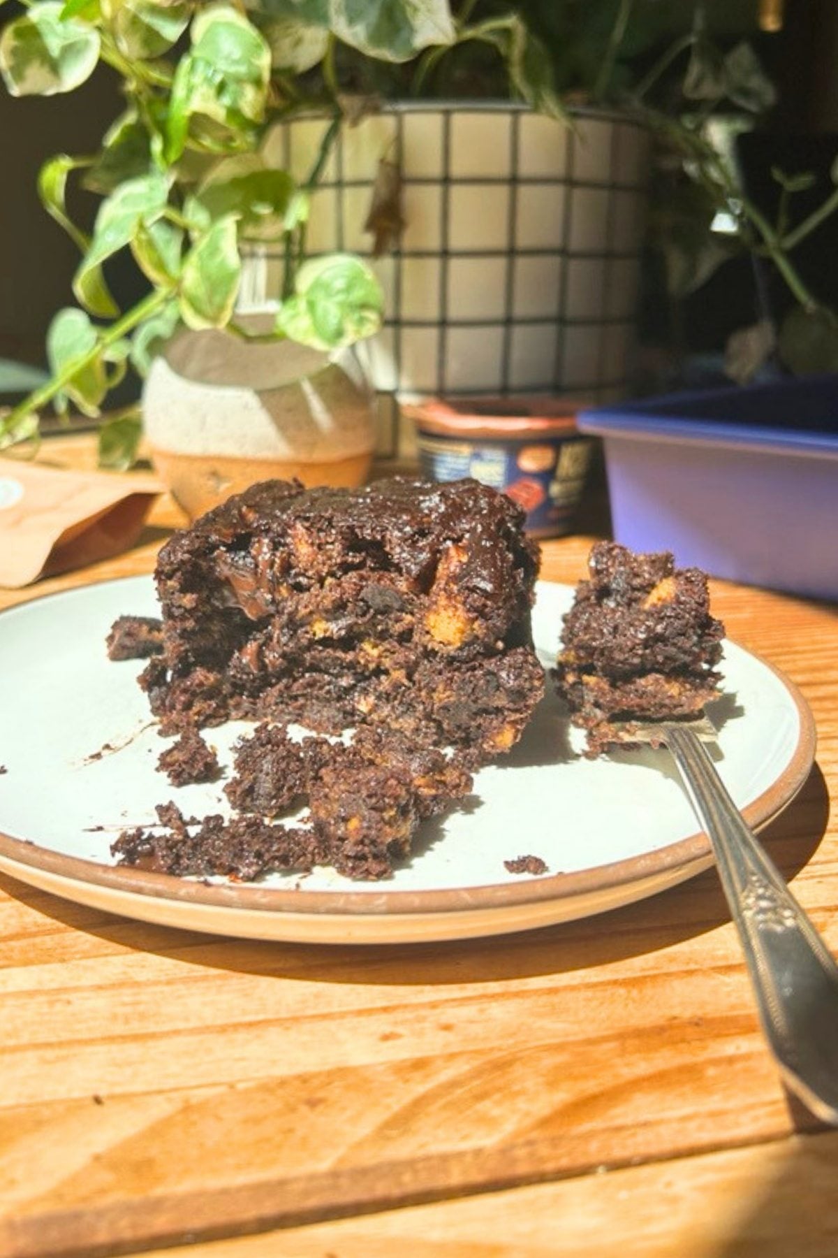 A stack of protein chocolate brownies on a white plate.
