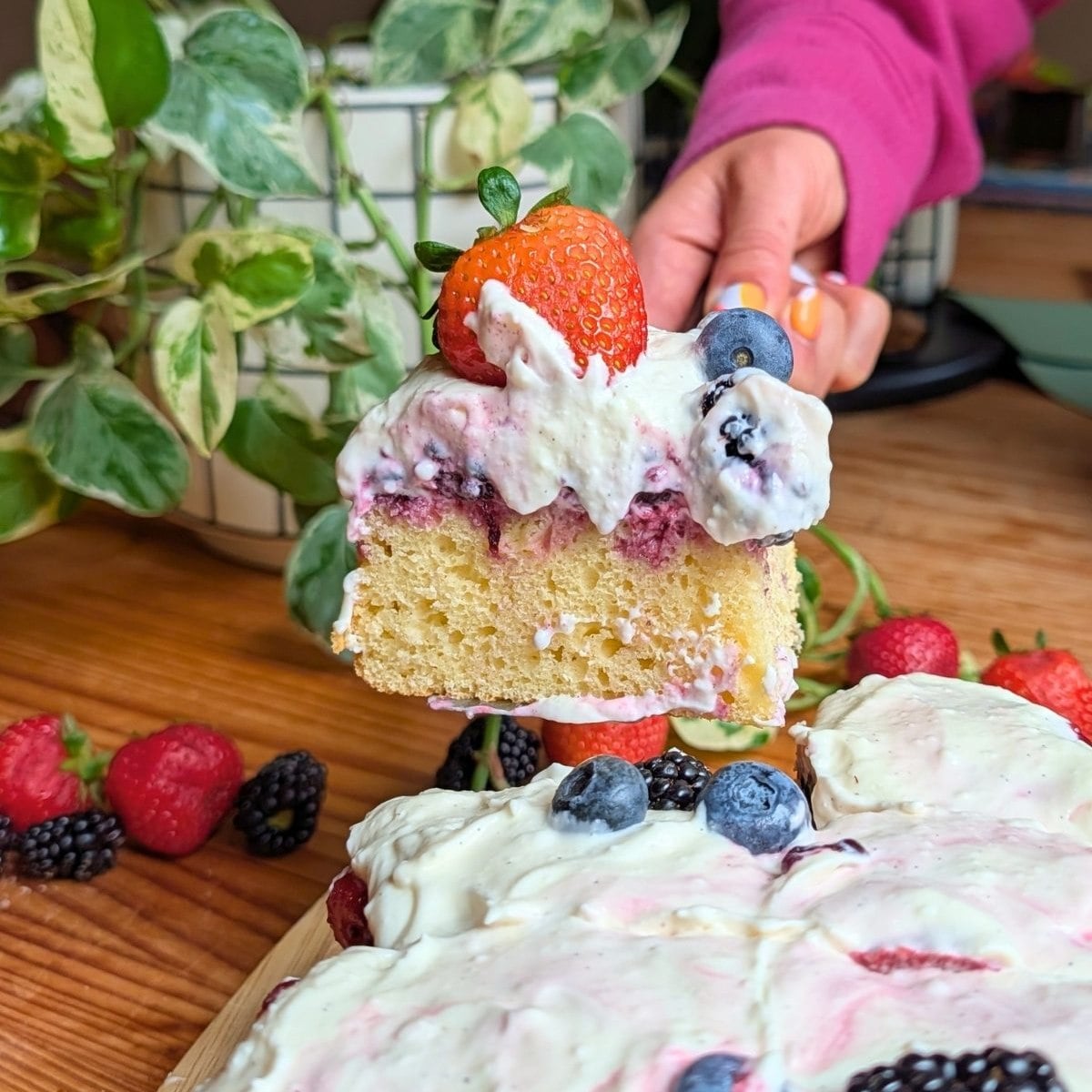 Picking up a slice of berry protien pound cake.