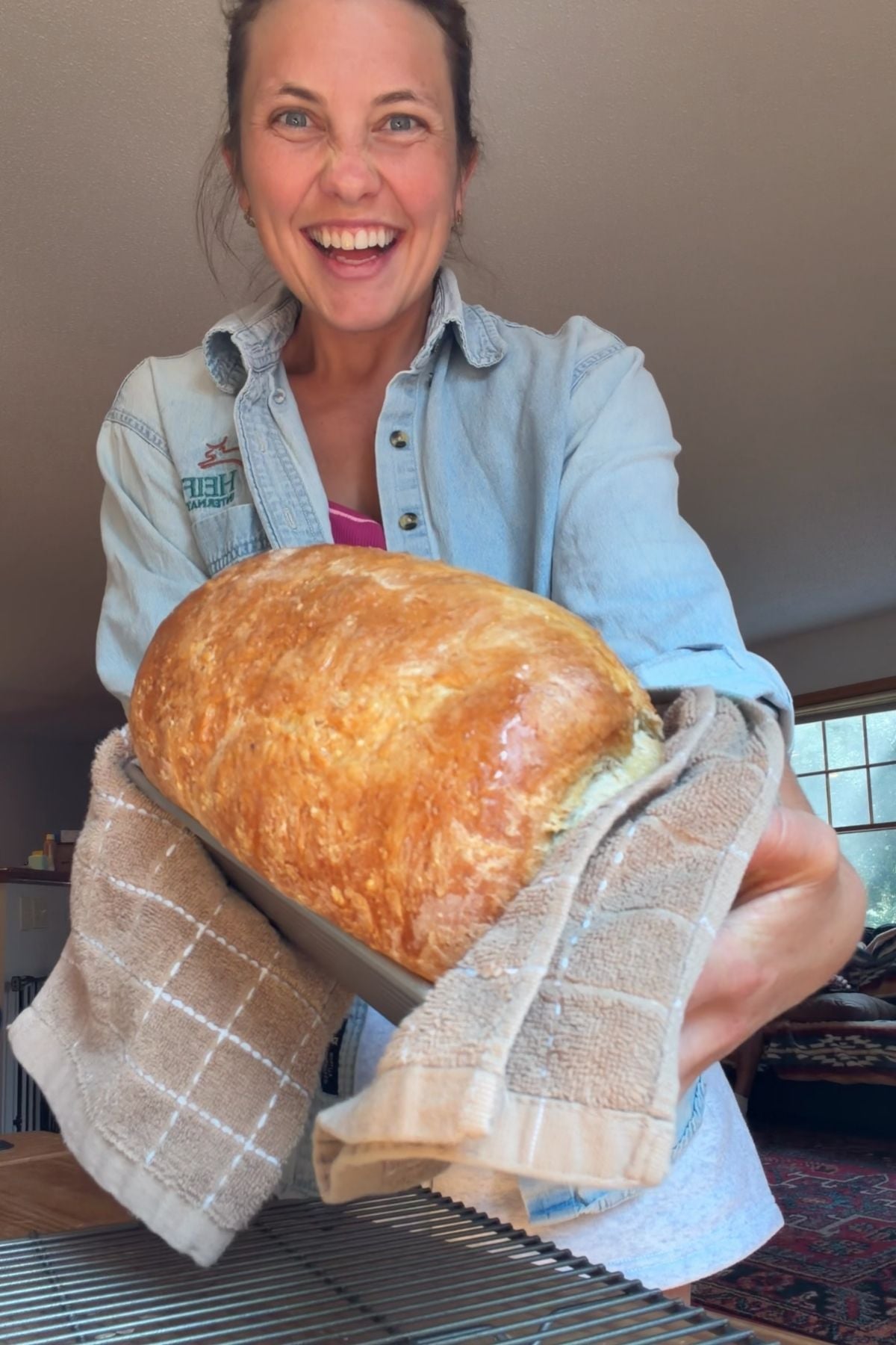Mika holding bread loaf.