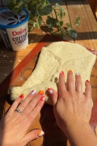 Rolling the dough into a log.