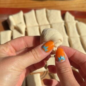 Shaping protein monkey bread ball pieces.