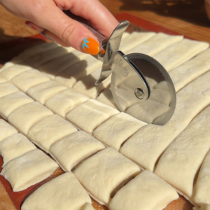 cutting the protein monkey bread dough.