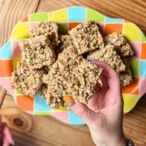 A hand holding a fall fiber rice krispie treat.