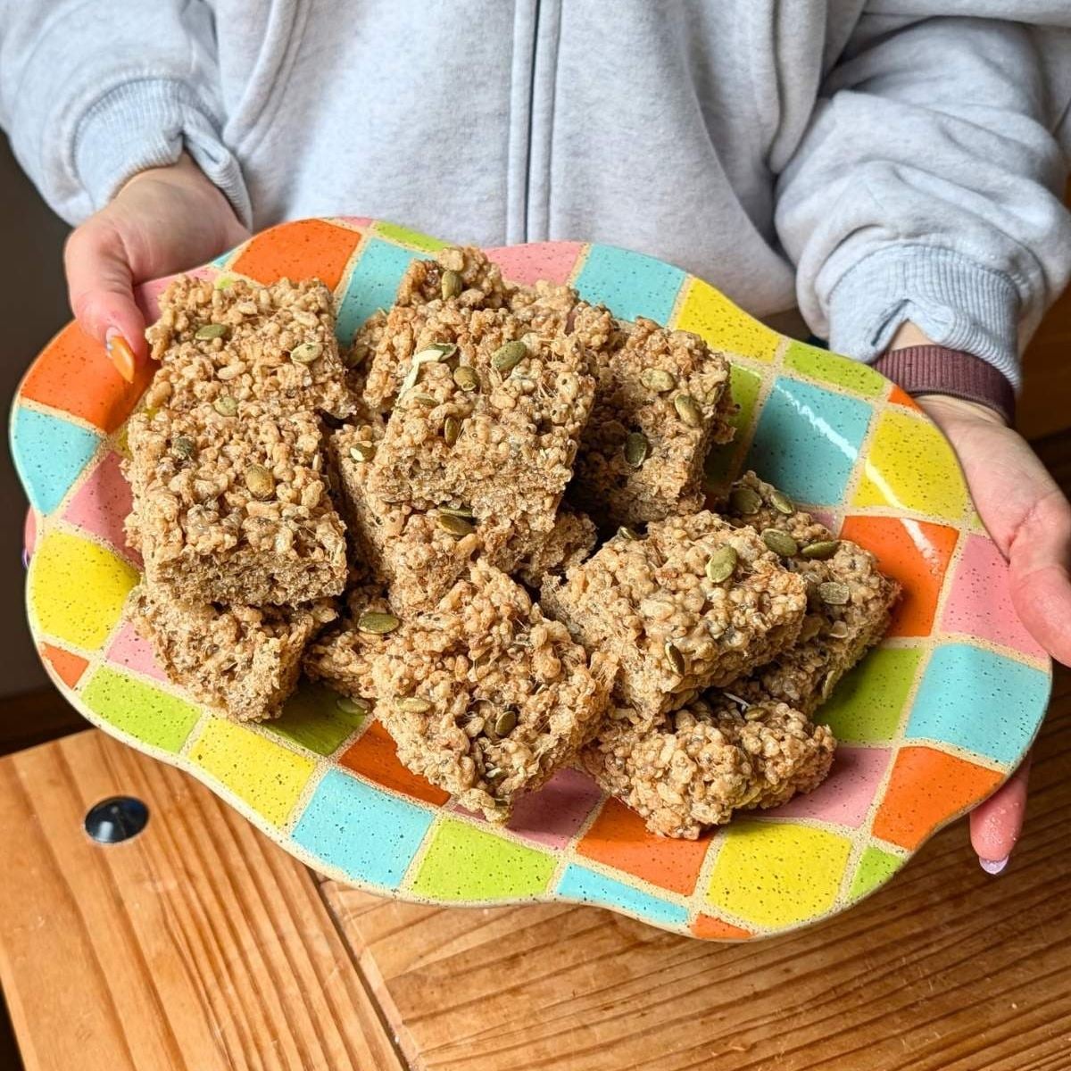 A colorful plate filled with fall fiber rice krispie treats.